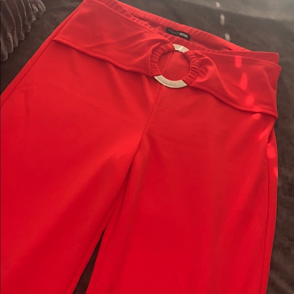 Red flare pants with gold detail